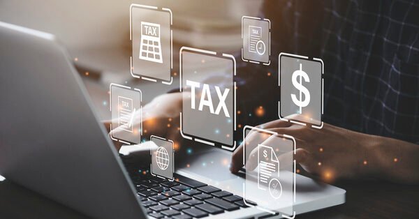 Busines using a computer to complete Individual income tax return form online for tax payment. Government, state taxes. Data analysis, paperwork, financial research, report. Calculation tax return.