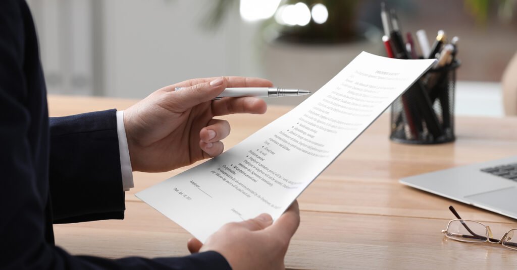 Man holding paper, portraying compliance challenges and opportunities.