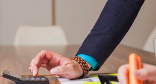Entrepreneur checking EU VAT compliance document for reverse charge VAT rules