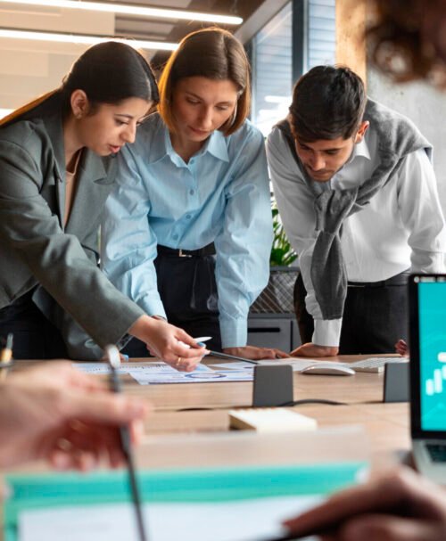 people analyzing checking finance graphs office scaled e1758622432125