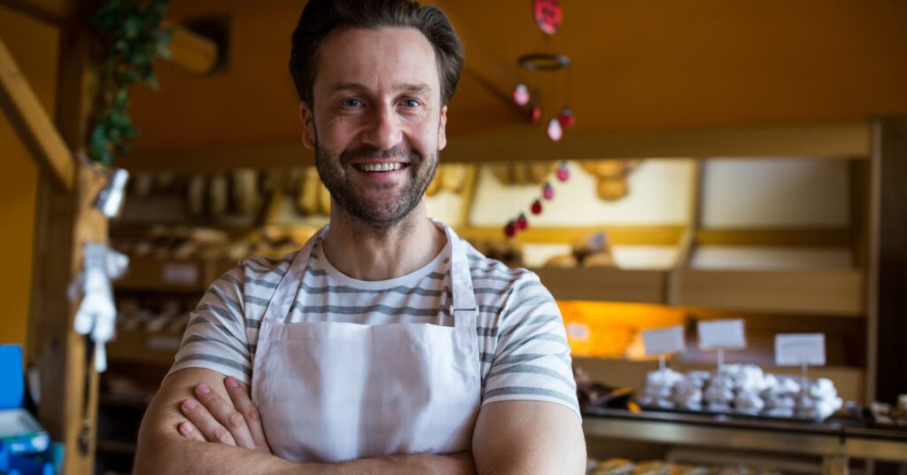 portrait smiling owner standing bakery shop scaled e1756716883786