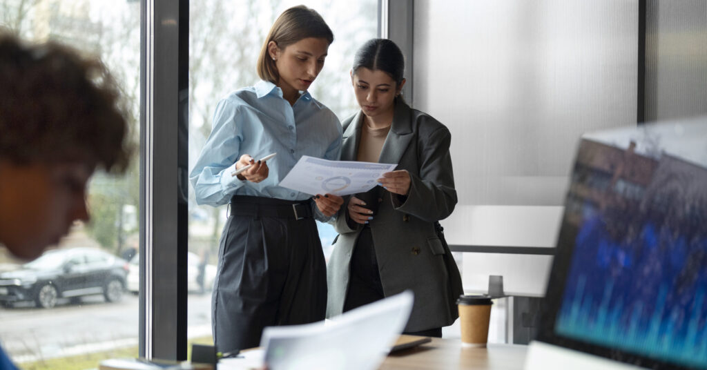 people office analyzing checking finance graphs scaled e1760701515683
