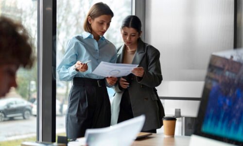 people office analyzing checking finance graphs scaled e1760701515683