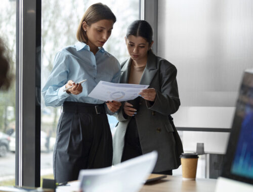 people office analyzing checking finance graphs scaled e1760701515683